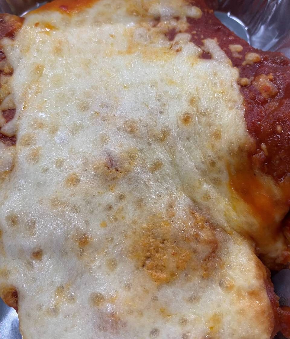 top view of a meal with melted cheese on top